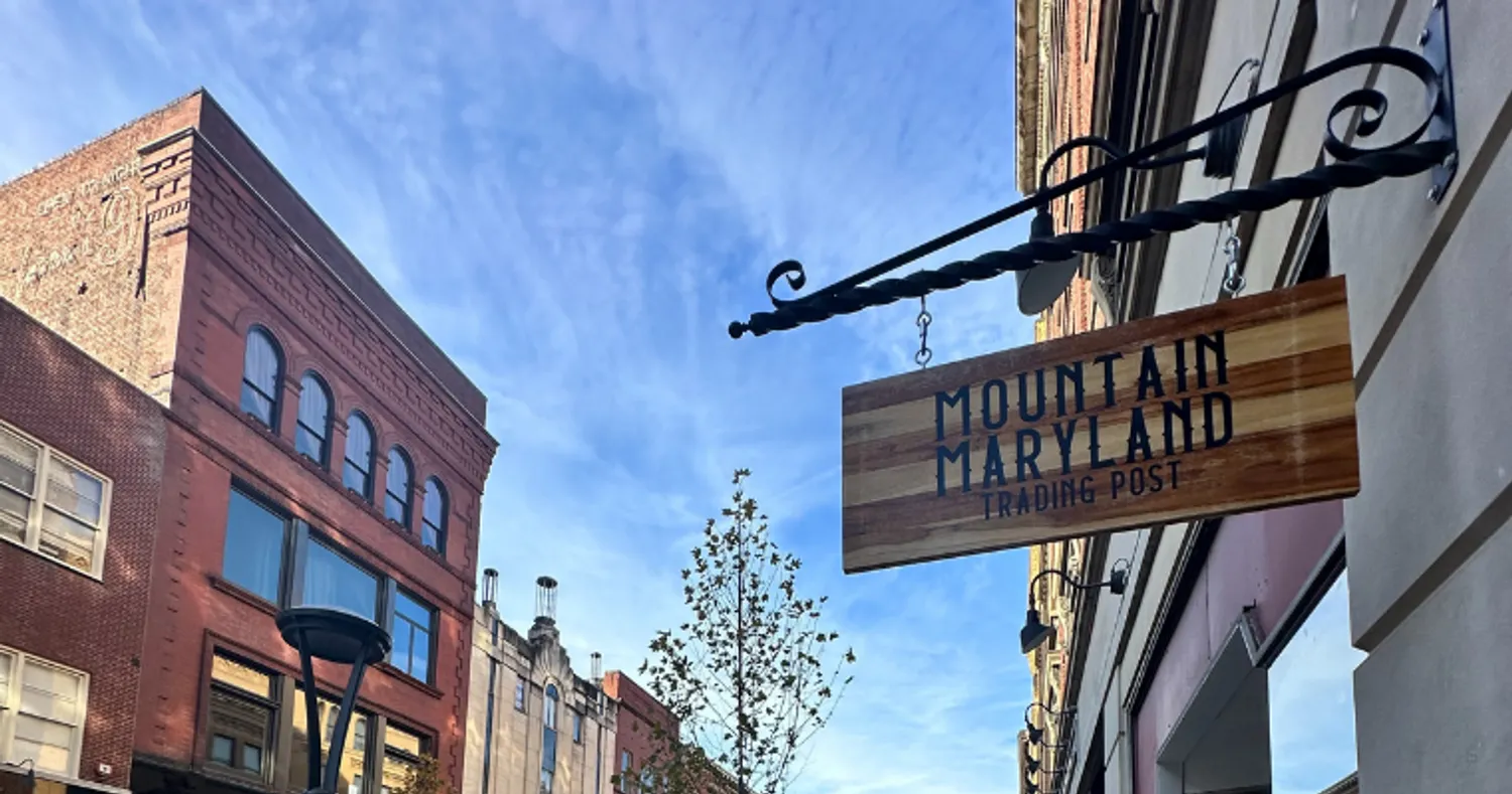 Outdoor signage of the Mountain Maryland Trading Post on Baltimore Street.