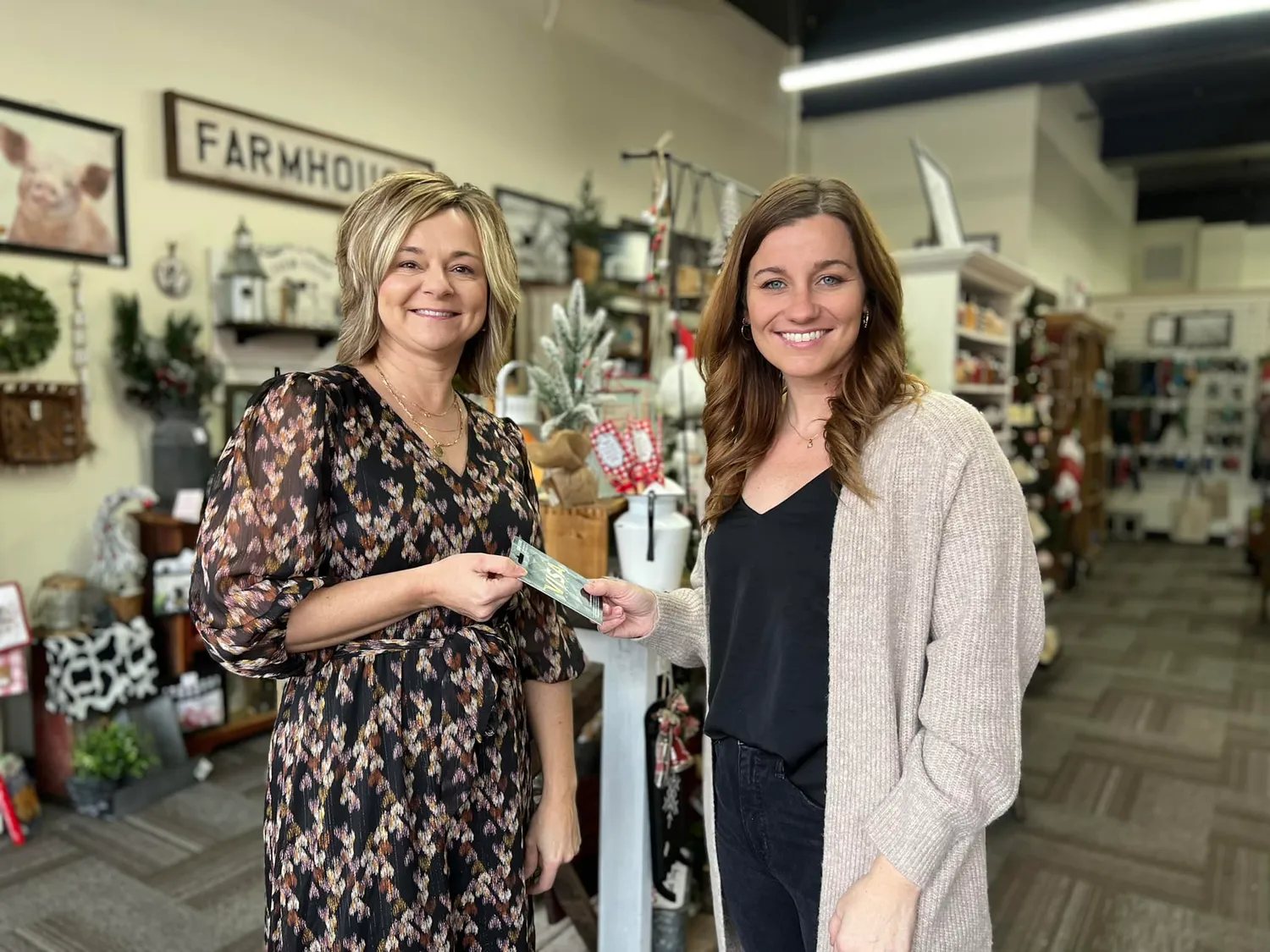 Ladybug Boutique Owner, Jennifer Holloway, and Director of Allegany County Tourism, Ashli Workman, stand in Holloway's shop.