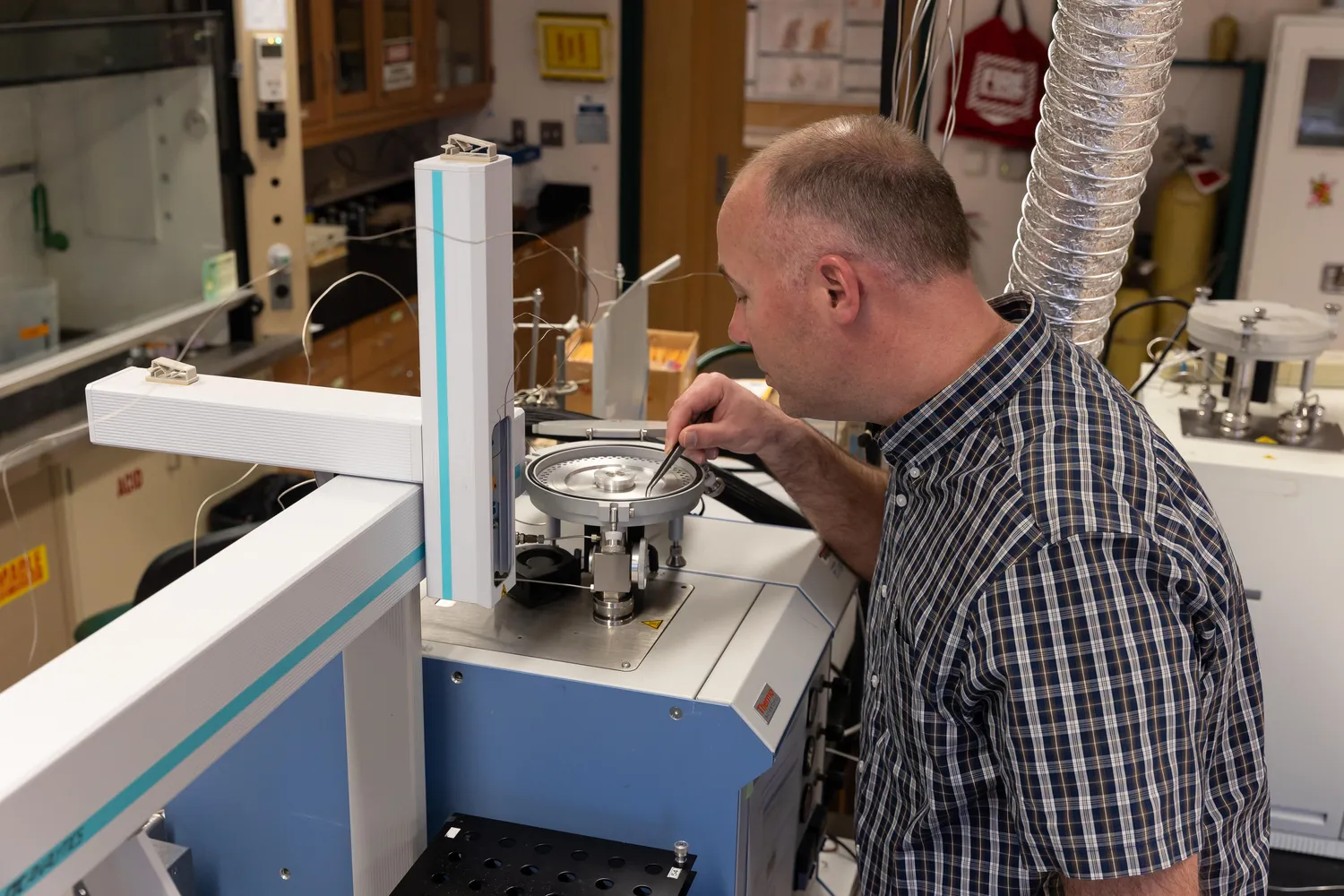 Scientist at the Appalachian Lab reviews an experiment.